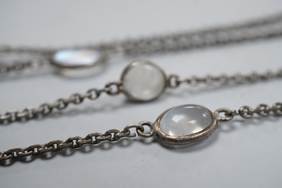 A silver and moonstone longchain necklace, set with cabochon moonstones, connected by a fine link chain, length 128cm, Condition: overall good condition, attractive moonstones and nice design. Silver with typical tarnish